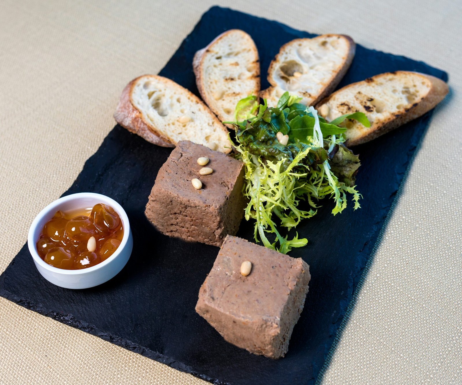 bread with sauce on black ceramic plate